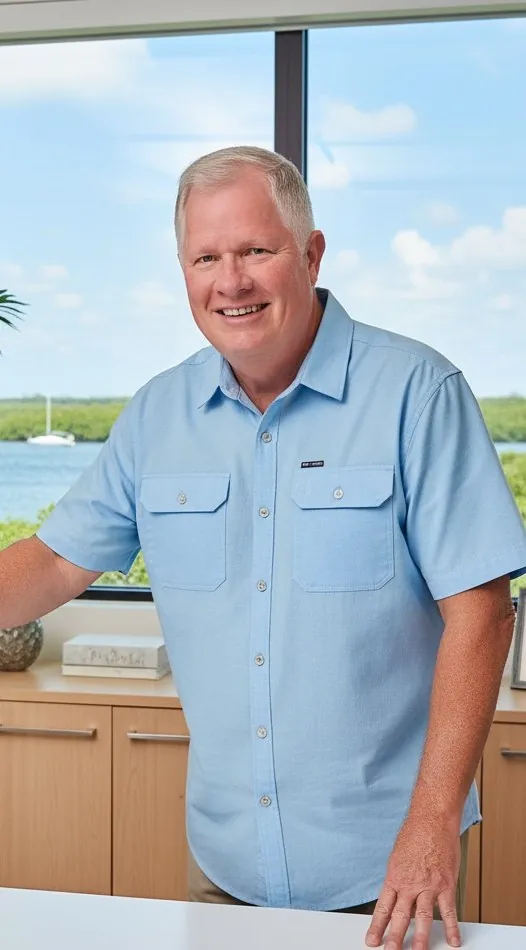 Ron Stevenson standing in a bright office